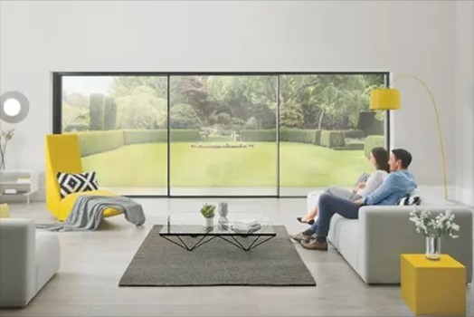 Origin sliding doors in a living room with a couple on a couch