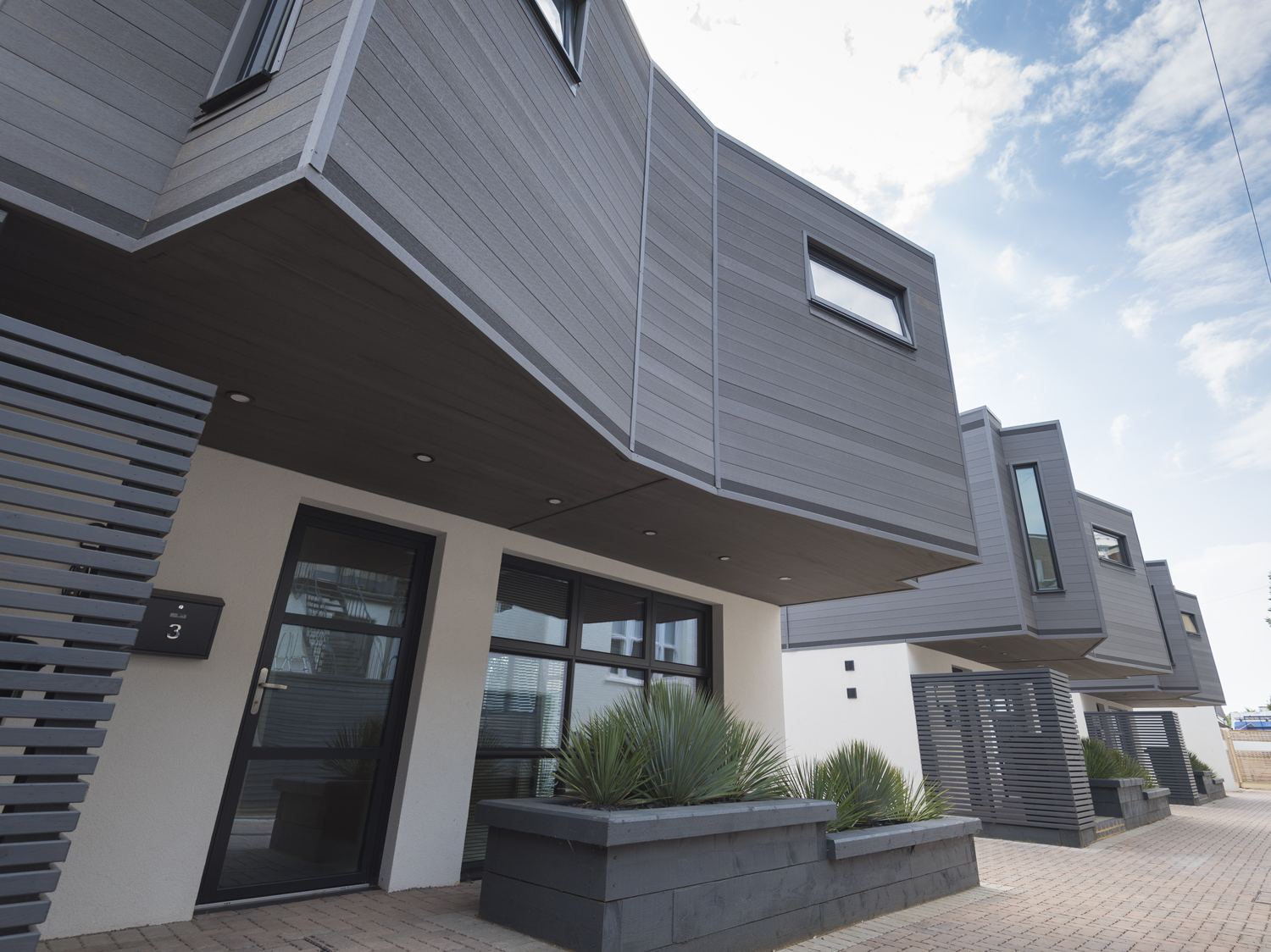 Ouside view of a row of modern housing