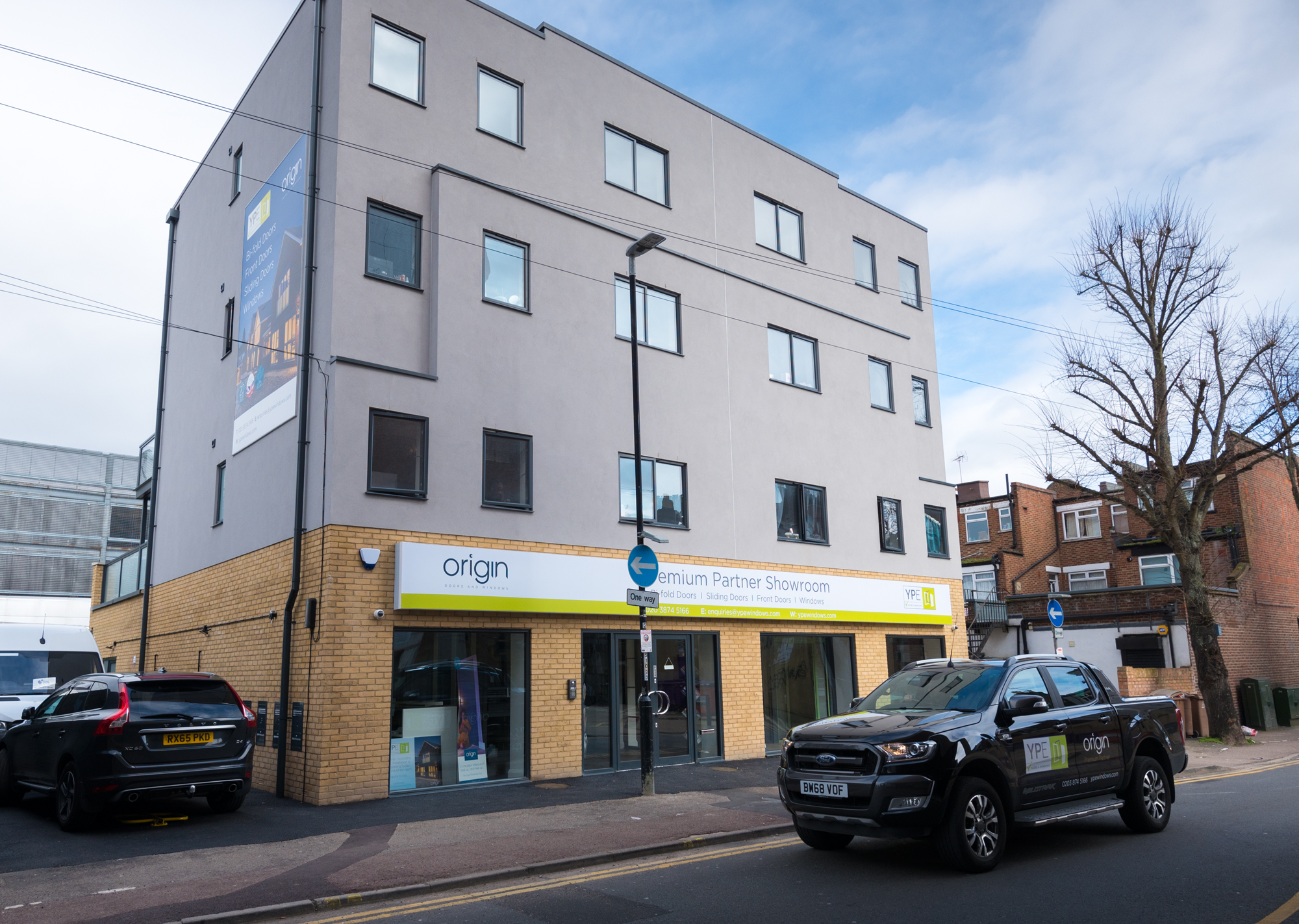 A decked out Origin showroom & block of flats