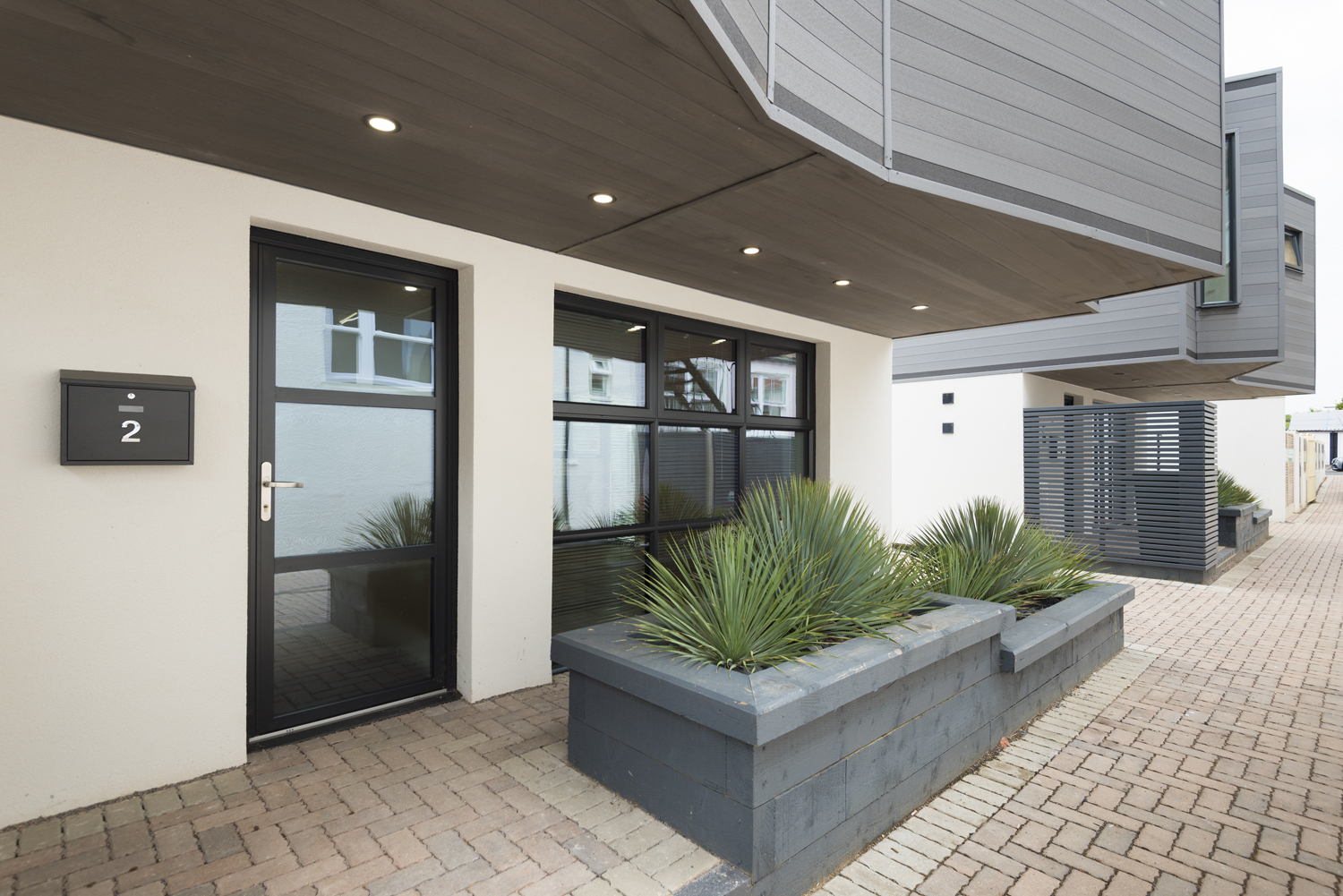 Front of a modern house showing off the front door