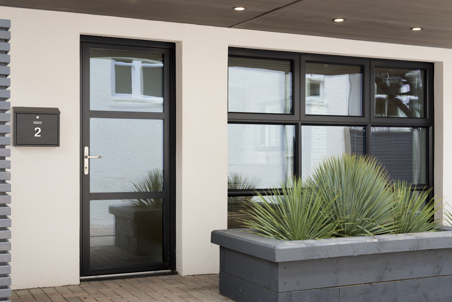 Close up view of a front door and windows